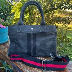 Black/gray canvas camo patterned bag with additional strap
